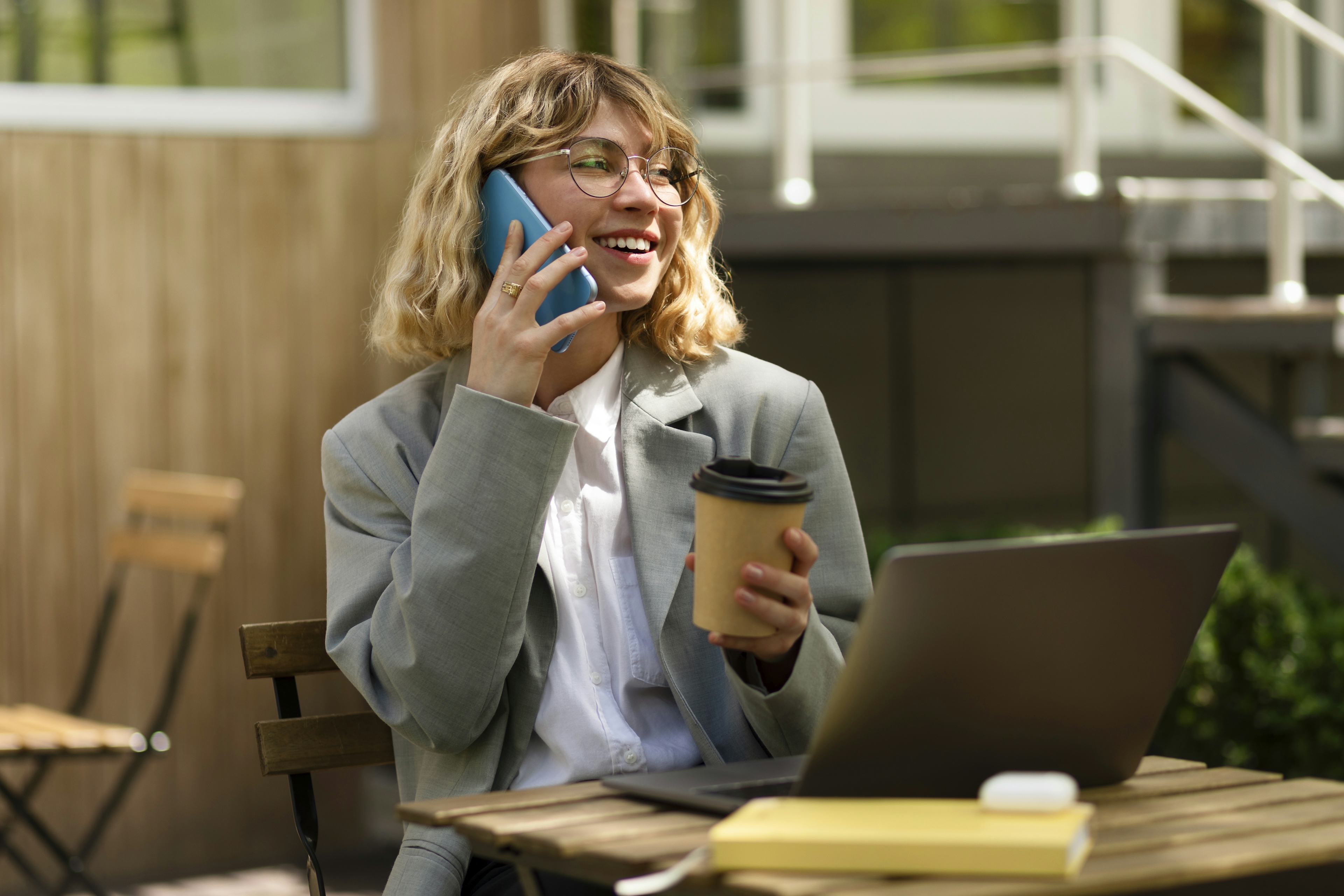 Smiling woman talking on phone with Good Monday